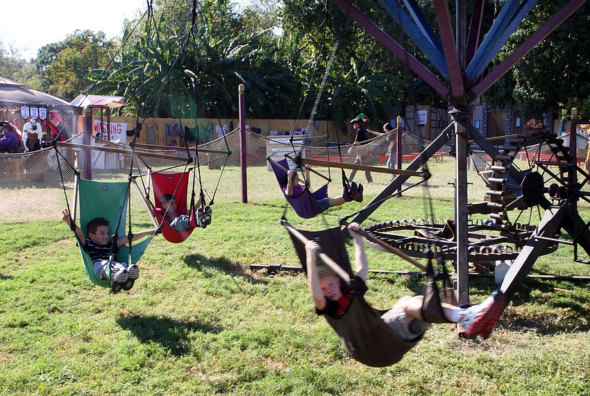 Kids ride The Flying Carrousel