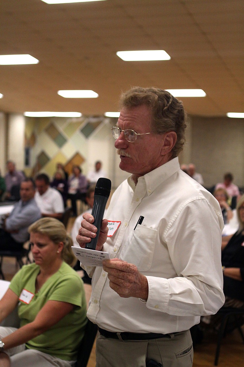 Bruce Dillon asks a question to the four finalists during the Q&A portion of the 