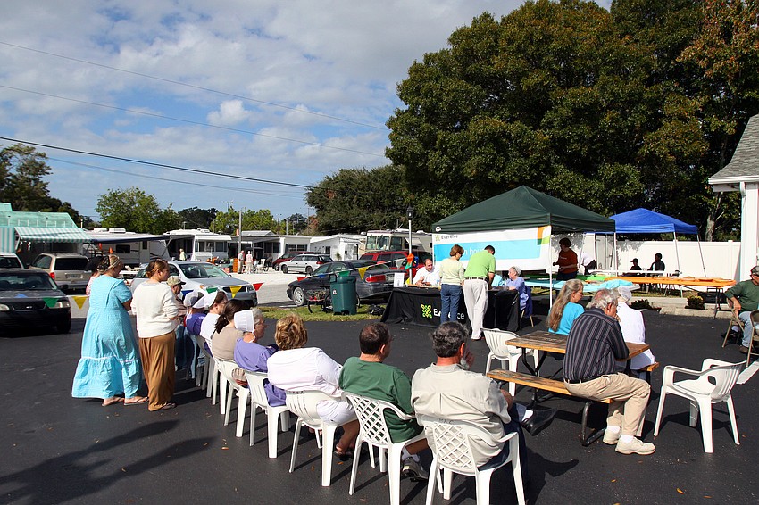 People patiently wait as the judges try and decide on winners for the three different categories of pies.