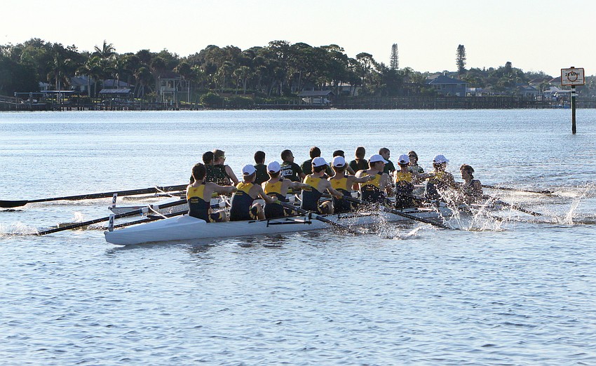 The USF team in the Mens Collegiate Novice 8+
and the Cape Coral team in the Mens Youth Novice 8+ row side by side.