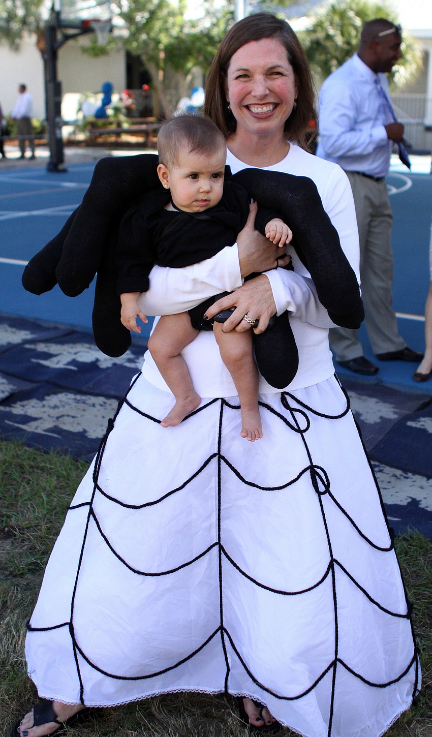 Angela Mejicanos dressed as a web and dressed her daughter, Stella, 7 mos., as an itsy-bitsy spider.