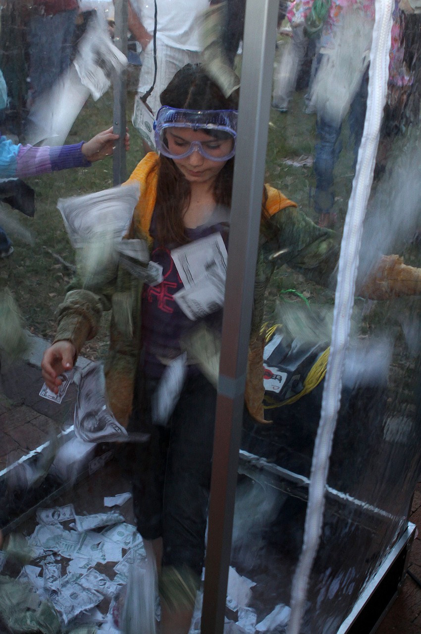 Ava Shaw tries to win some money in the â€œCash Cubeâ€. Shaw won one dollar.