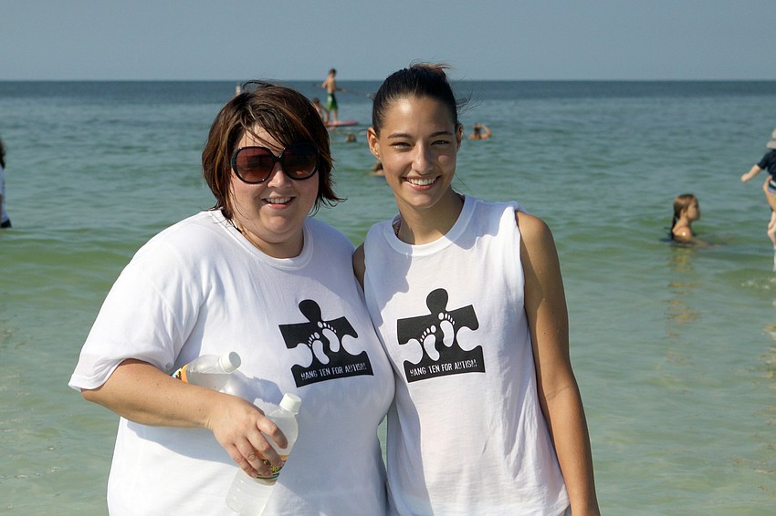 Candice Woodworth and Melina Simunovic were two of the 112 volunteers that came out to help with Hang Ten for Autism Saturday, Sept. 17, at the Siesta Key Public Beach.