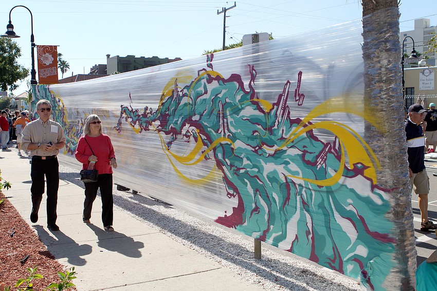 New to the Chalk Fest was art done on saran wrap-like material that wrapped around between trees along Pineapple Avenue.
