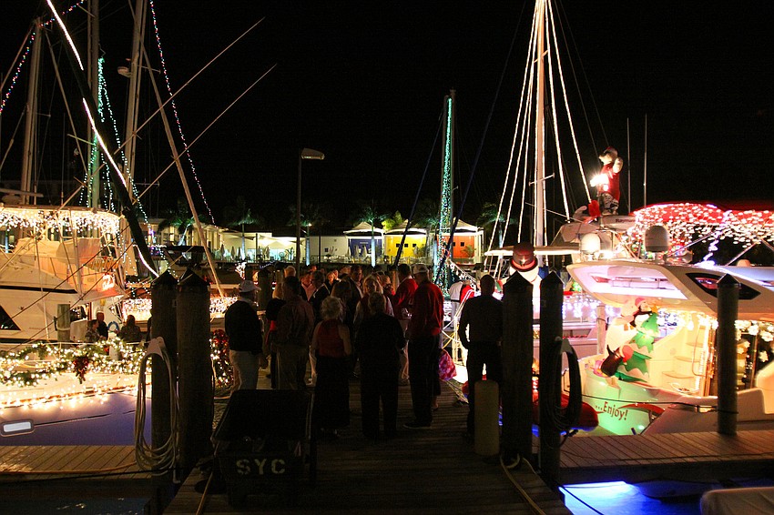 People enjoyed chit chatting with one another on the docks and on their boats, Friday, Dec. 2, during the 