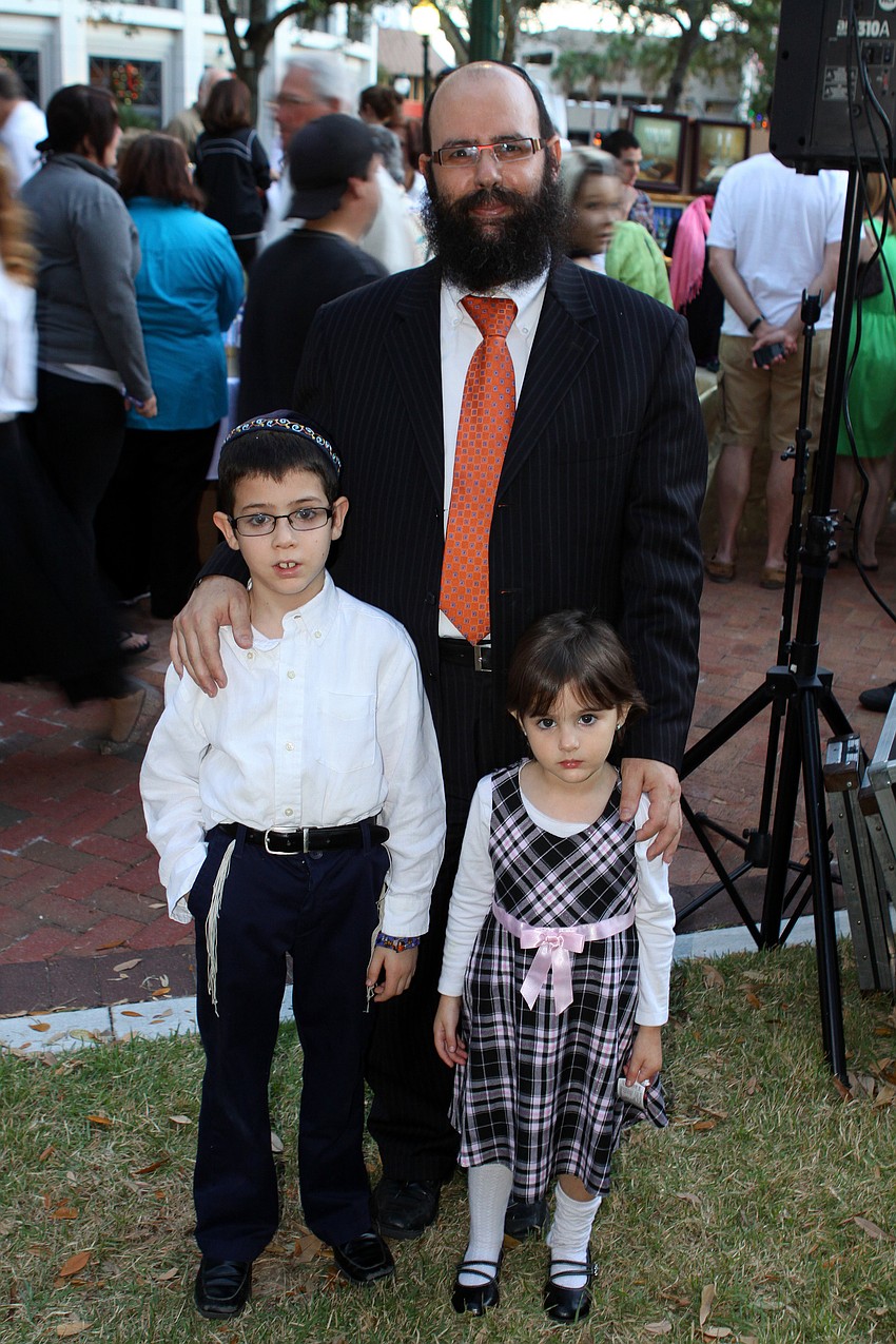 Rabbi Chaim Steinmetz poses with his children, Shmuli, 7, and Chana, 4.