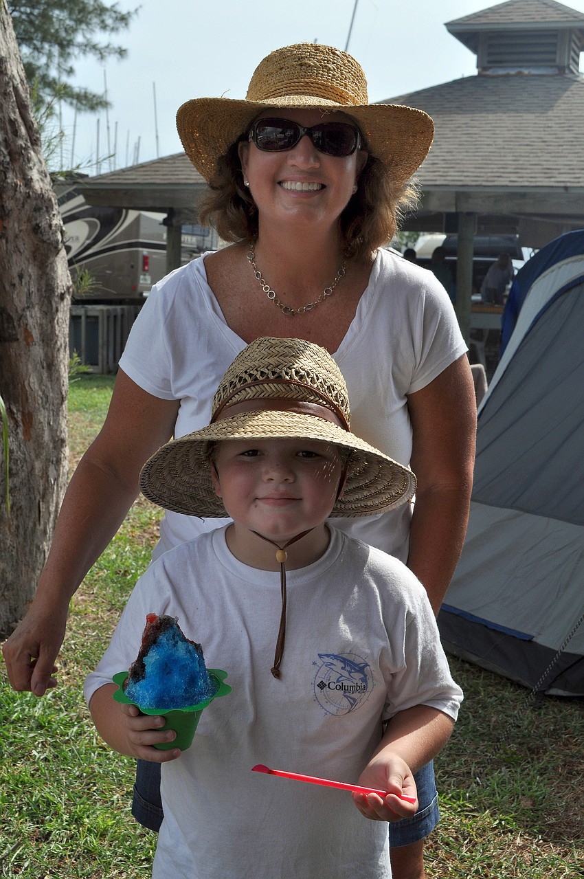 Pam and Beck, 6, Braxton enjoy some Hawaiian shave ice Saturday, Sept. 3 at the 65th Labor Day Regatta at the Sarasota Sailing Squadron.