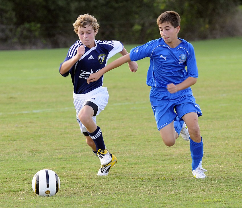 : Kyle Maddry of the Brandon Flames tries to maneuver the ball past Everton Pascoâ€™s Matthew Nelson, right.