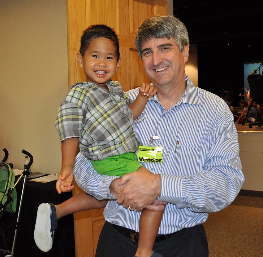 Mark Holley of Lakewood Ranch Financial brought his 2-year-old son, Kion, to the expo.