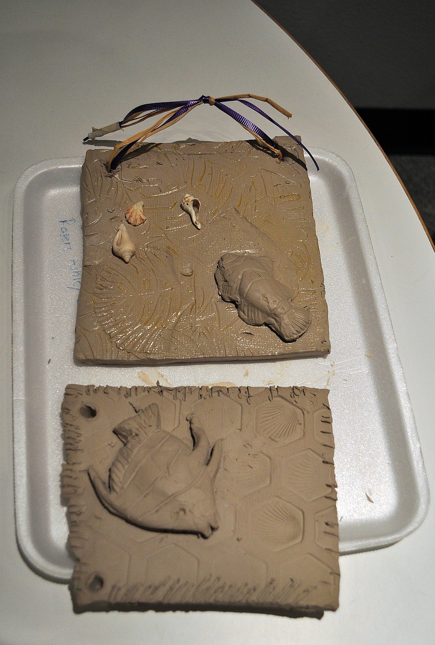 Two demo fossil plaques were on display for the kids to look at for inspiration.