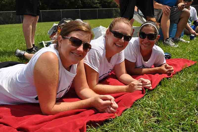 Gina Fielding, Amanda Becker and Karla Hoppe watched other teams play.