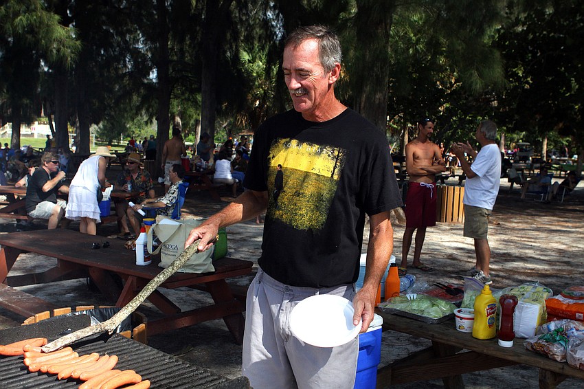 Jack Haley had to use a large stick in order to roast some hot dogs for the potluck.