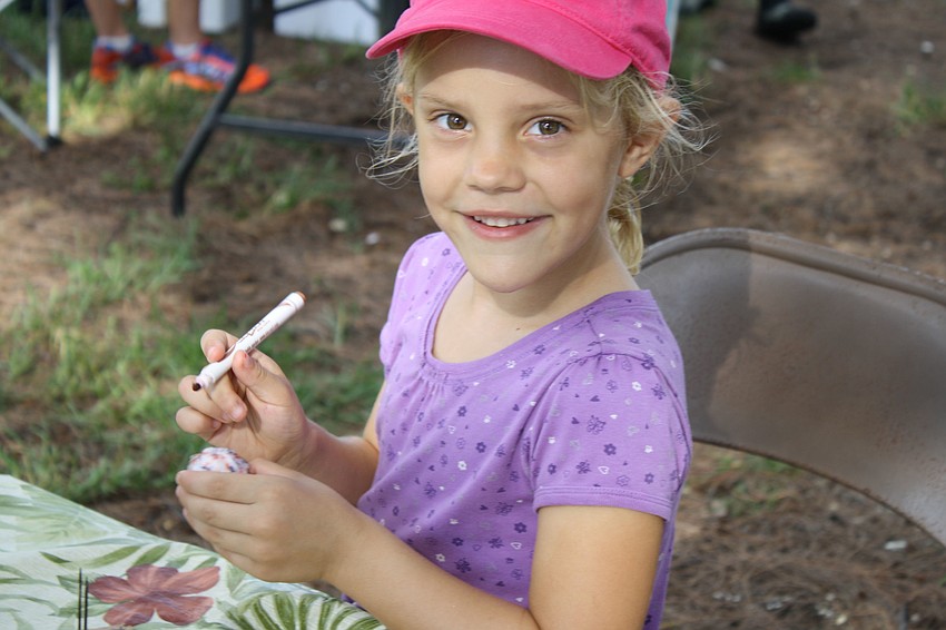 Josie Jorgensen makes a Snowy Plover Chick as part of the Sarasota Audubon Societyâ€™s contribution to National Estuaries Day.