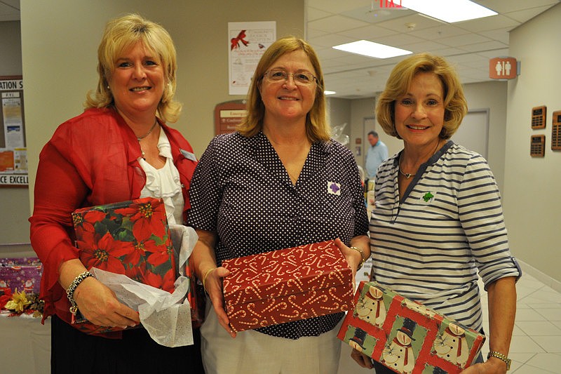 Maribeth Phillips, Ellan McMorrow and Nancy Caffiero manned the Christmas Shoebox fundraiser.