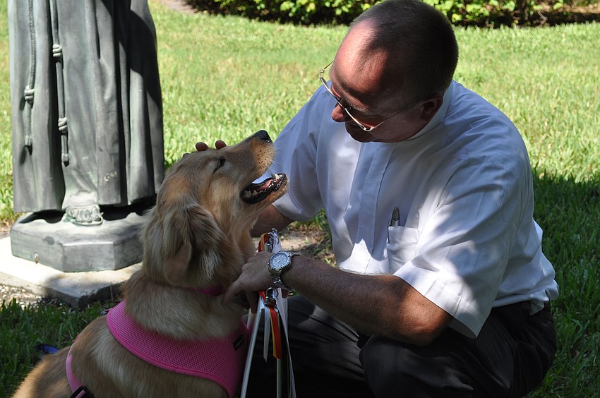 Rev. Bernthal blesses Lucy.