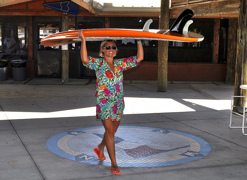 Sara Herbert brings her board over to where some of the other boards were kept.