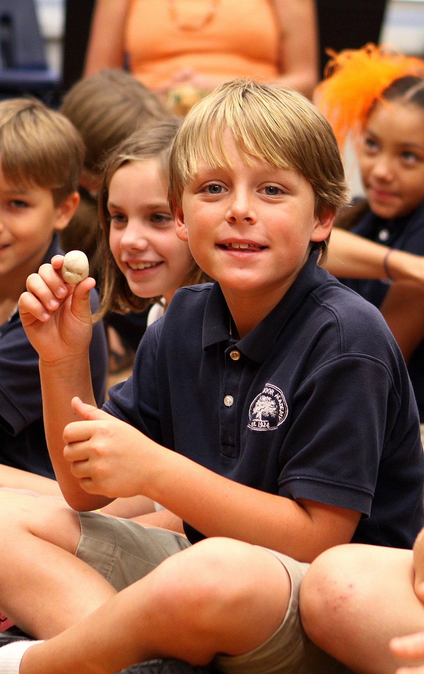 Schaffer Clatt, 9, shows off the oil clay that he caught from Jack Dowd Thursday, Oct. 13 at ODA.