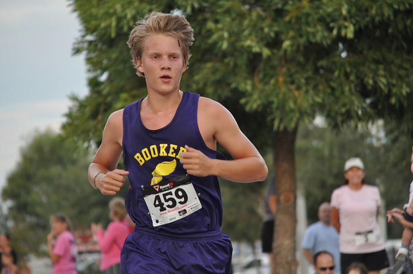 A student from Booker blazes through the finish line.