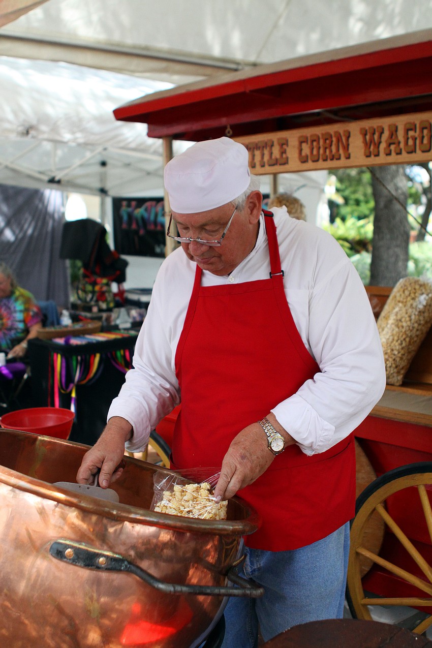 Jim Findlay fills up bags with fresh kettle corn.