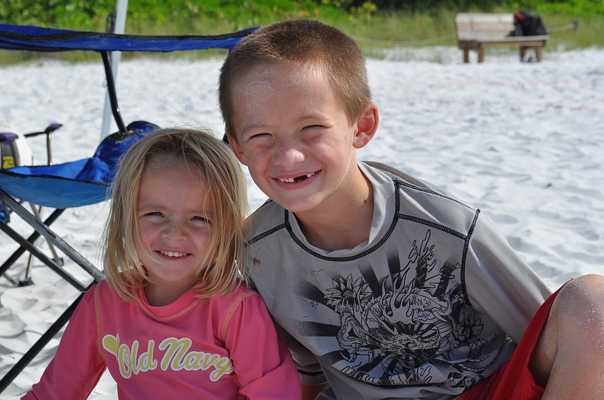 Casey and J.T. Corr watch the teams compete.