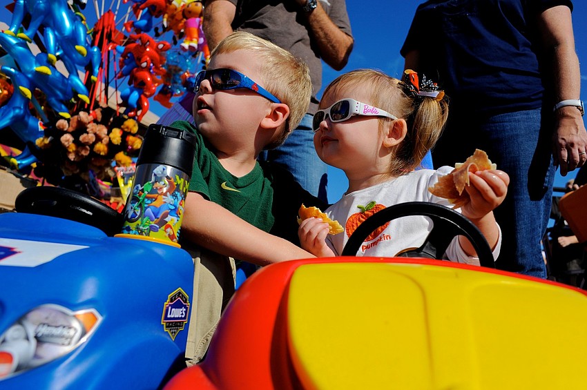 Three-year-old Landon Hunt and his younger sister, Lauren, 1, enjoyed all of the sights and sounds at this yearâ€™s Pumpkin Festival.