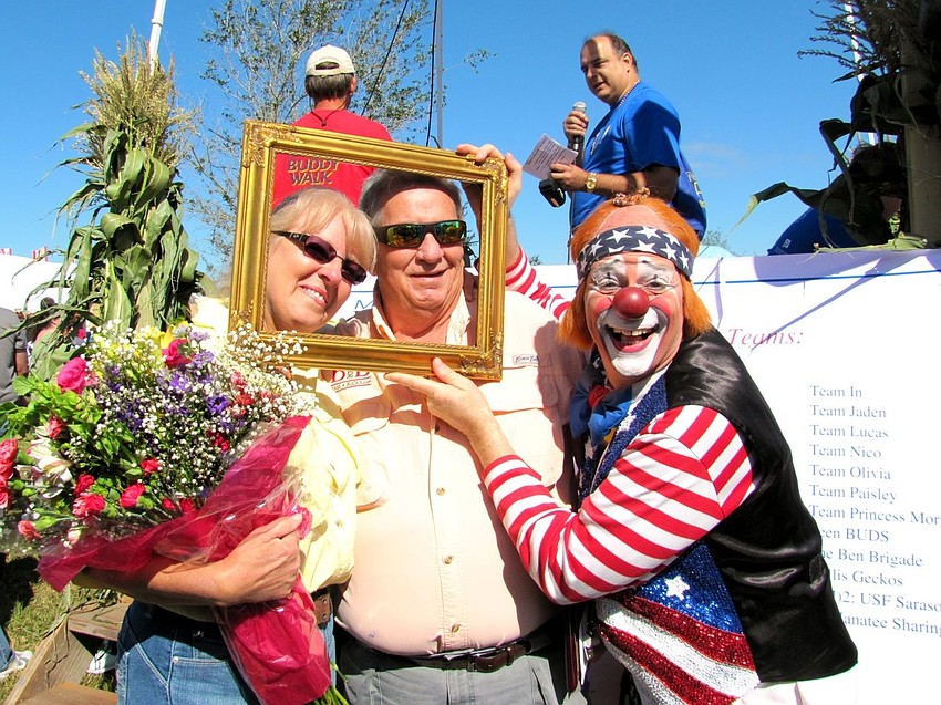 Sue and Chris Egler were awarded a plaque for exceptional service to Manasota BUDS families through their Bass4Bucks raffle and bass tournaments over the past several years. Photo Courtesy of Stacy Quaid.