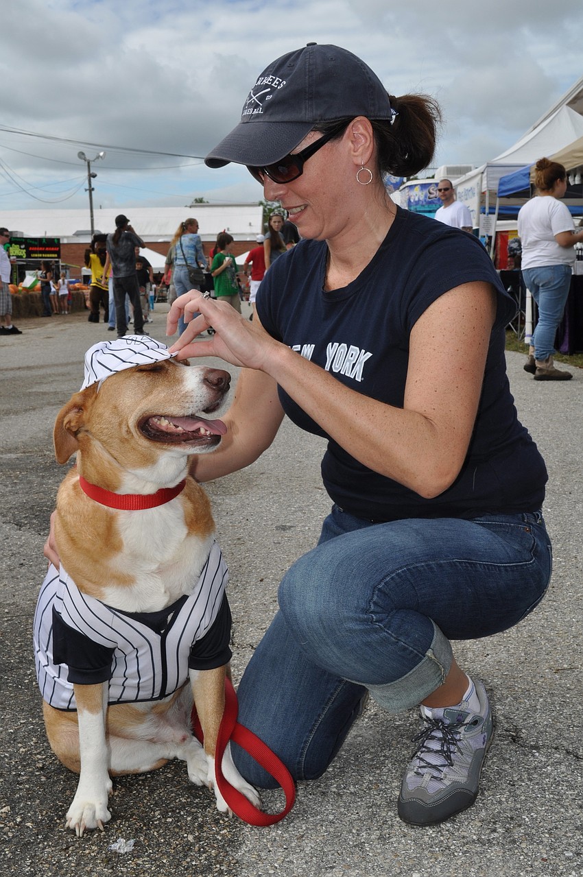 Laura Schiess adjusts Toby's hat.