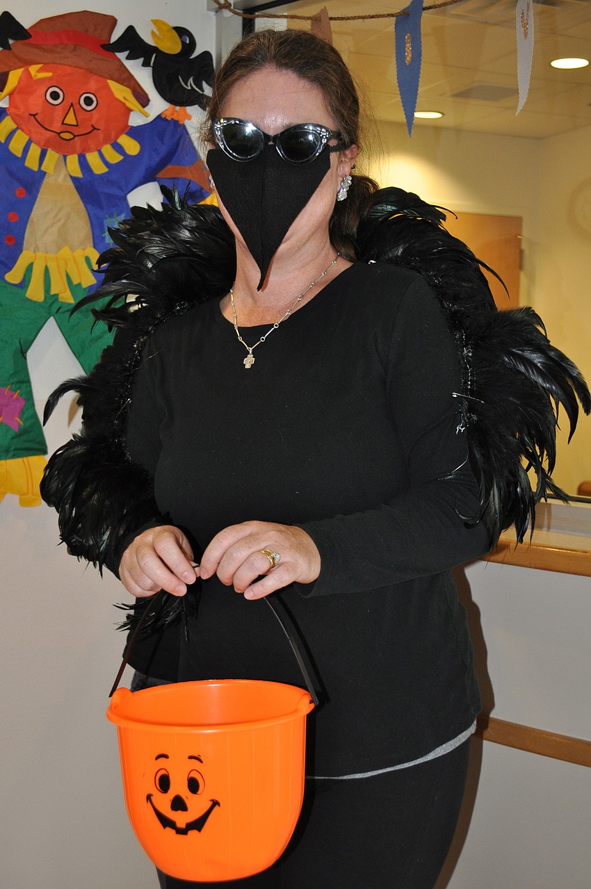 Celene Berman dressed as a black swan.