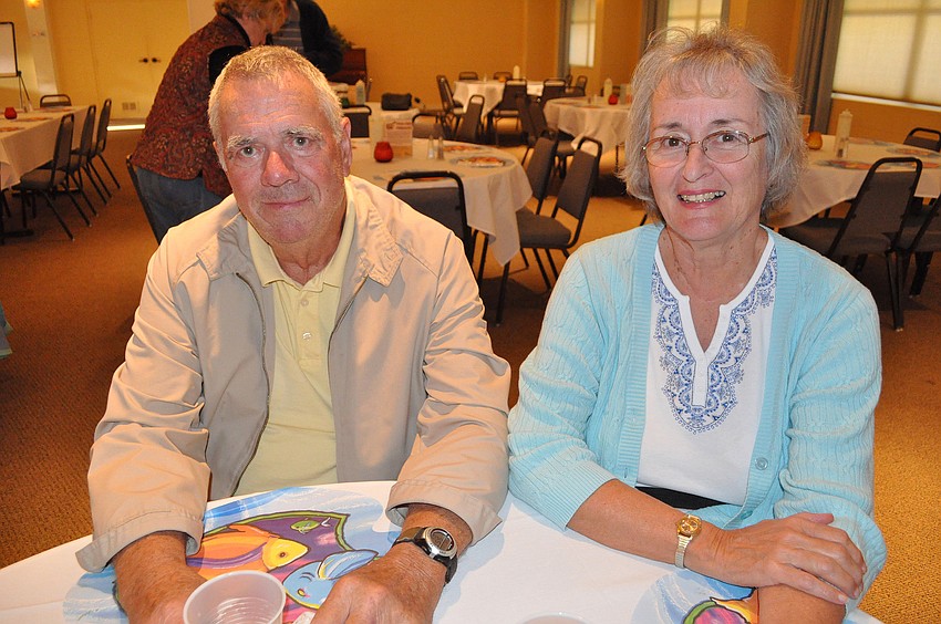 Glen and Carole Ballinger wait to hear their numbers called to get their fish fry feast.
