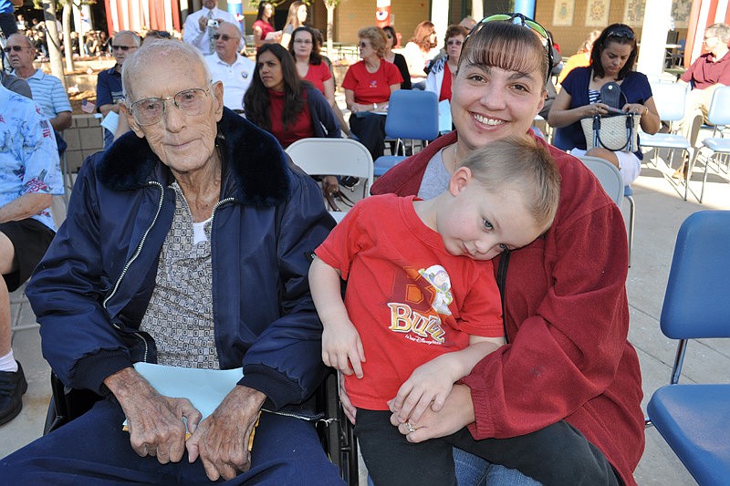 The name of veteran Ashby Morris, pictured with his granddaughter Julie Stanton and great-grandson, Justin Stanton, was included in this year's Wall of Honor panel.