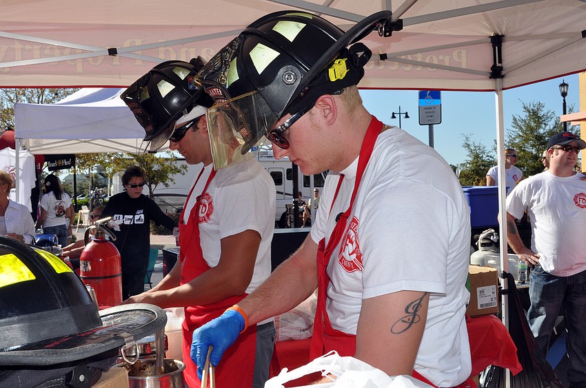 Jordan McPherson and Jeff Philips served chili for West Manatee Fire Rescue.