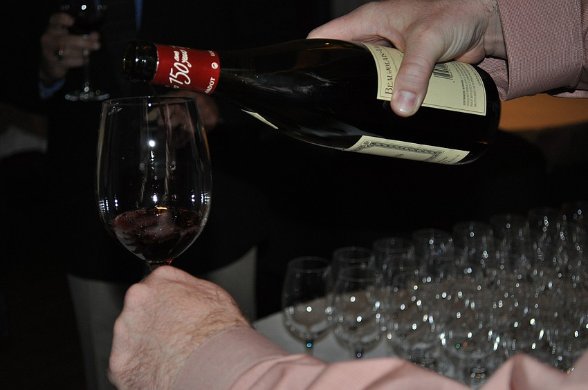Matt Cannon pours glasses of wine