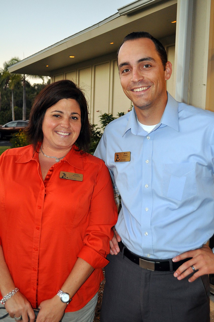 Alana Tomasso and Kevin Cooper pose outside Wells Fargo Bank, Thursday, Nov. 17, at the Chamber's After Hours and Business Card Exchange.