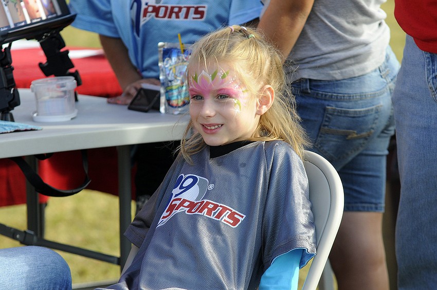 Tara Elementary first-grader Beatrix Turner took a break from playing baseball to get her face painted.