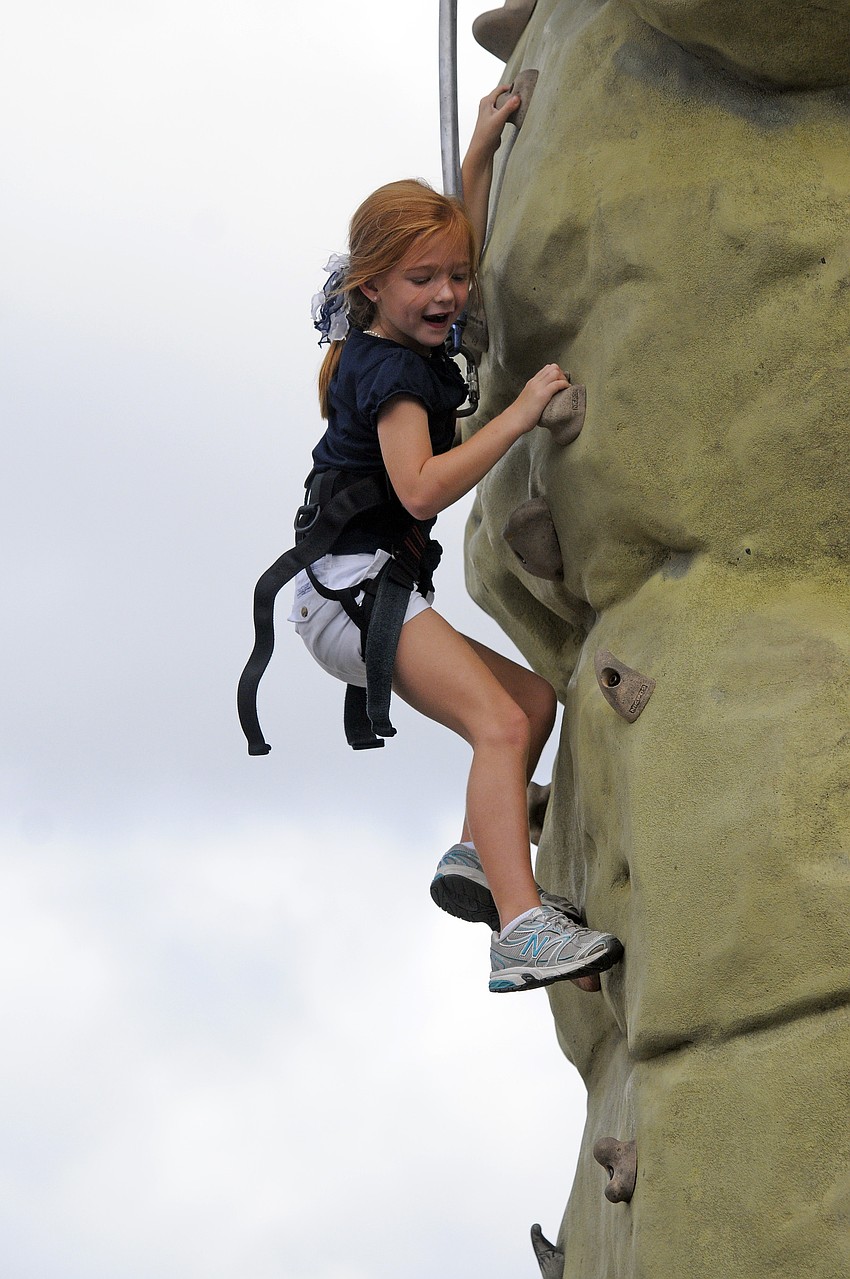 Six-year-old Kendall Dooley was determined to successfully make her up the rock wall.