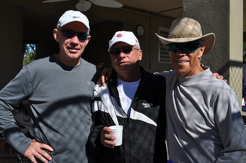 Mike Melnik (middle) coaches doubles partners Tom McCune and George Wachtel