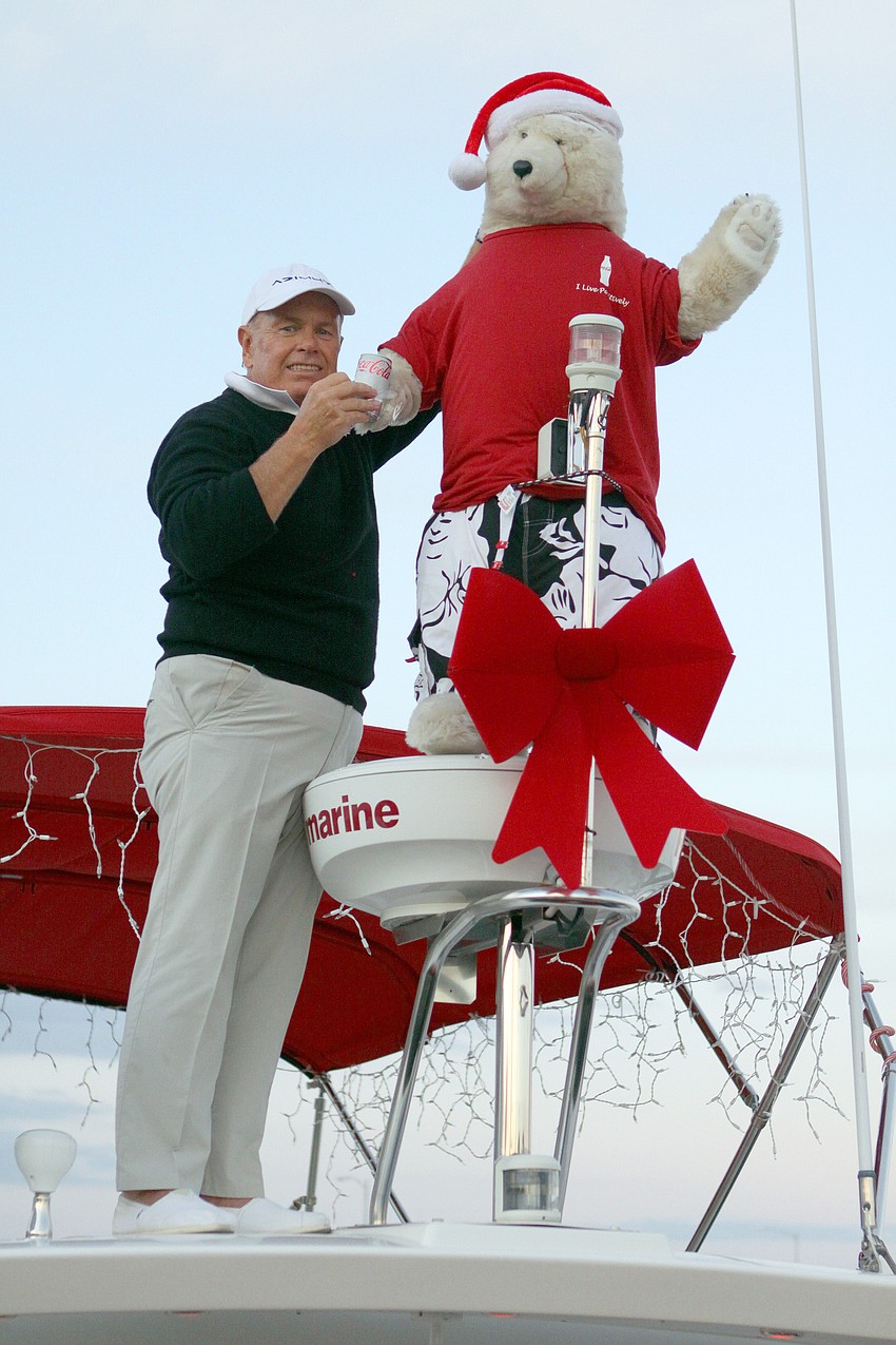 Jonathan McCague works on fixing up the Coca-Cola Polar Bear on the boat 
