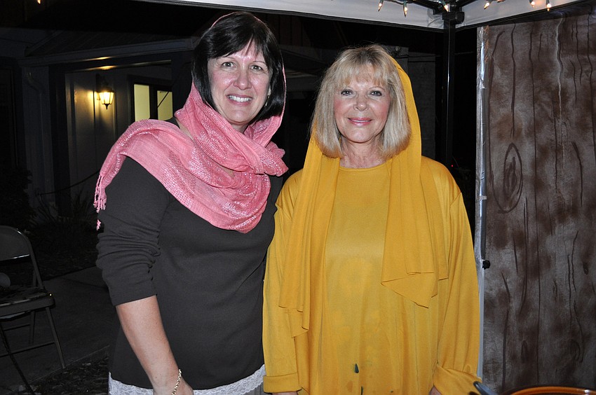 Rae Dowling and Nancy Holt served tea to guests at the spice and candle shop.