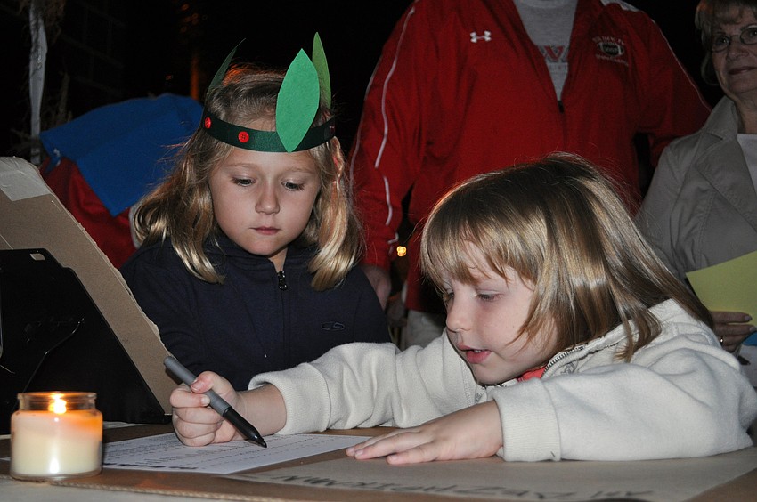 Five-year-olds Abi Simmons and Jacqui Montalvo practiced writing the Greek alphabet.