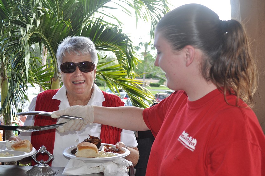 Claire Arbour and Sara Miller with Port-A-Pit Bar-b-que