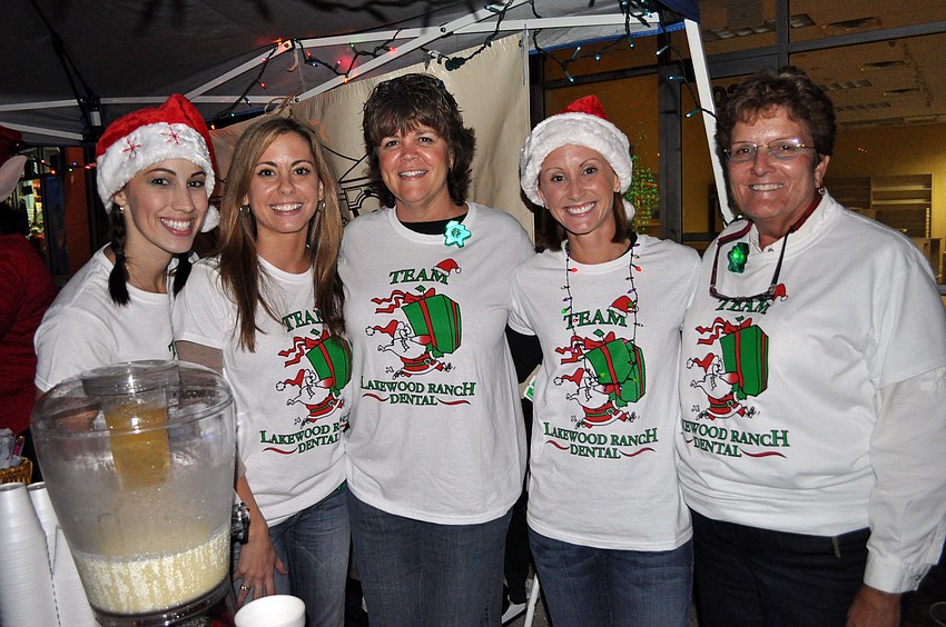 Lakewood Ranch Dentalâ€™s Jamie Lynn, Martha Williams, Kelley McLane, Kim Gillett and Rachelle Petrin served eggnog to guests.