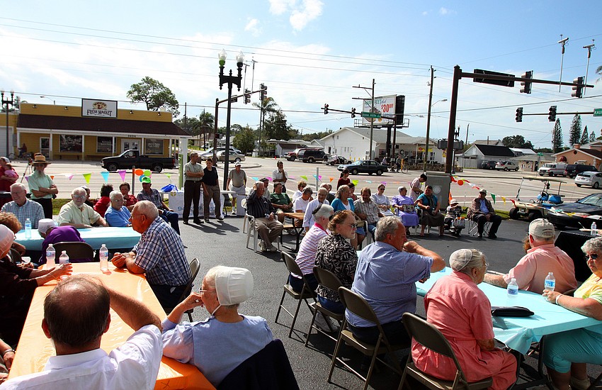 Spectators and pie makers hang out in the parking lot during the 1st annual pie contest, Friday, Dec. 9 at Everence Federal Credit Union.