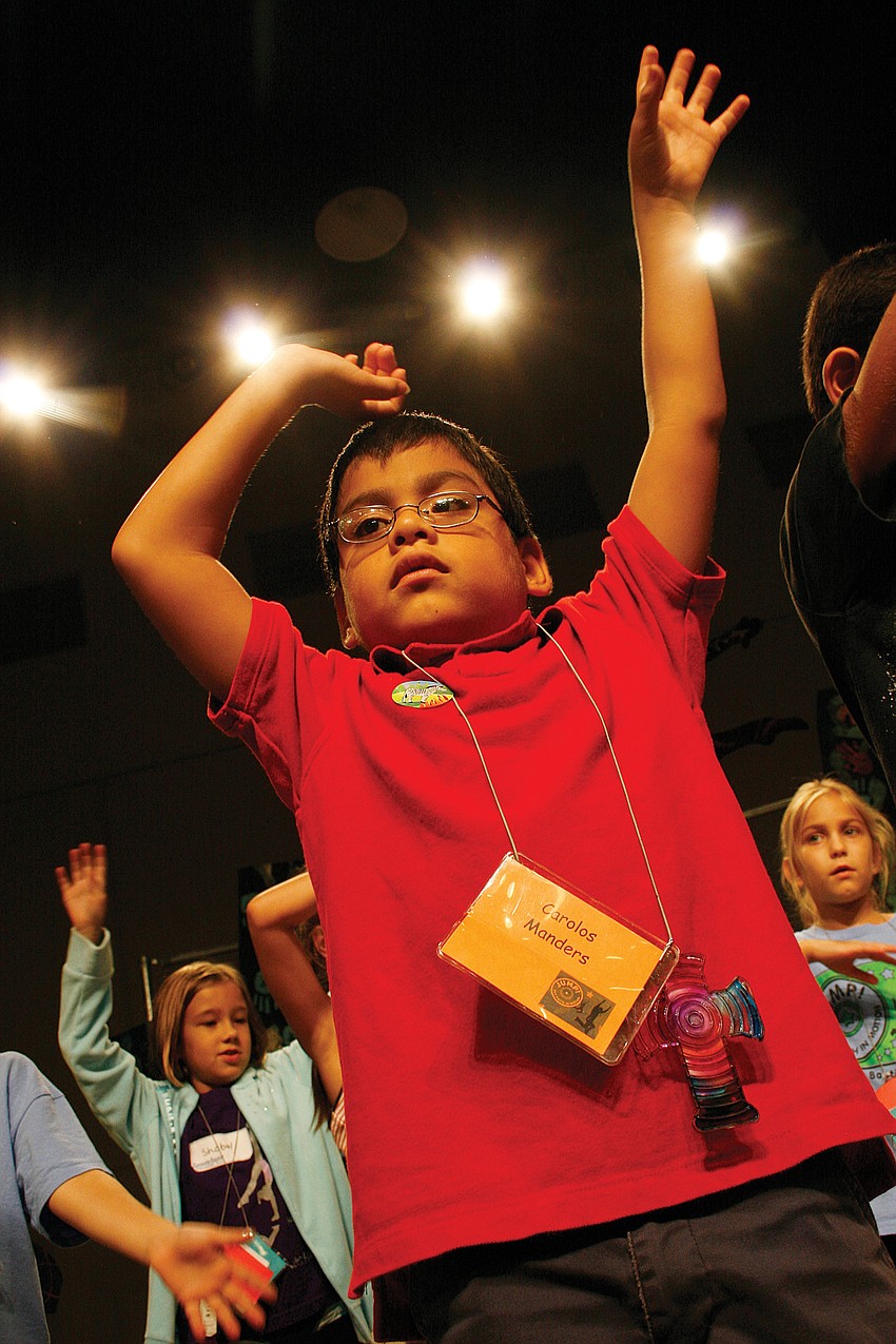 Carolos Manders loved dancing on stage during Sarasota Baptist Church's Vacation Bible School Aug. 8-12. Published Aug. 18, 2011.