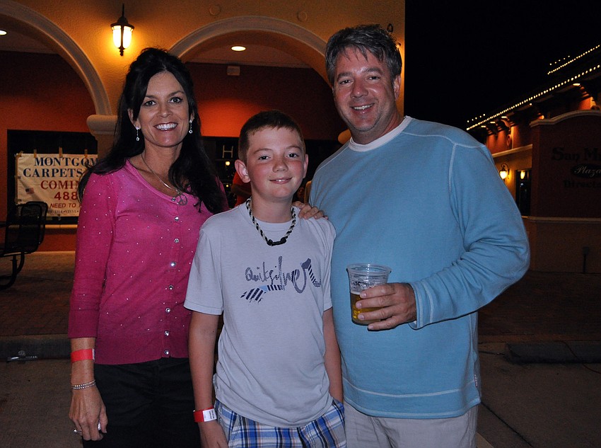 April Sugamura, Colton Branham, 10, and Troy Branham came out to show their support for the Humane Society of Manatee County.