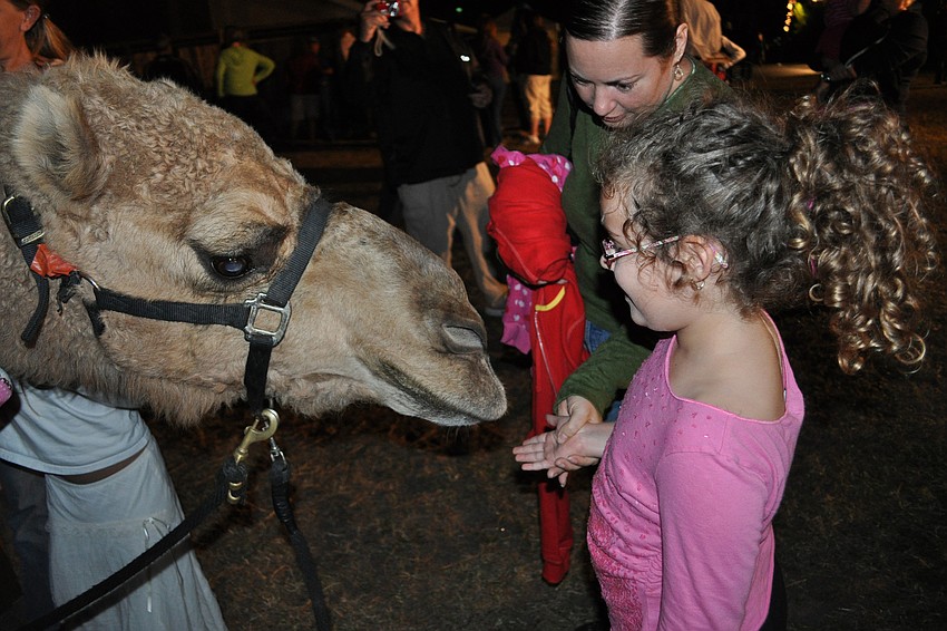 Lilian Ireland, 6, and her mother, Landra, made sure to greet the camels.