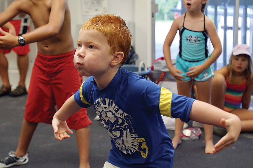 Jacob Antczak mimics a puffer fish during a game of 