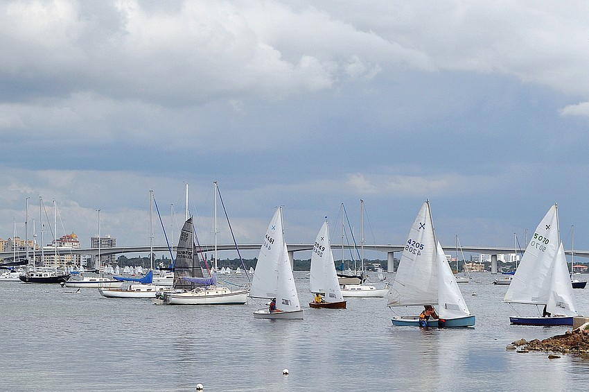 Sailboats in the windmill class compete in the 65th Labor Day Regatta in September at the Sarasota Sailing Squadron.