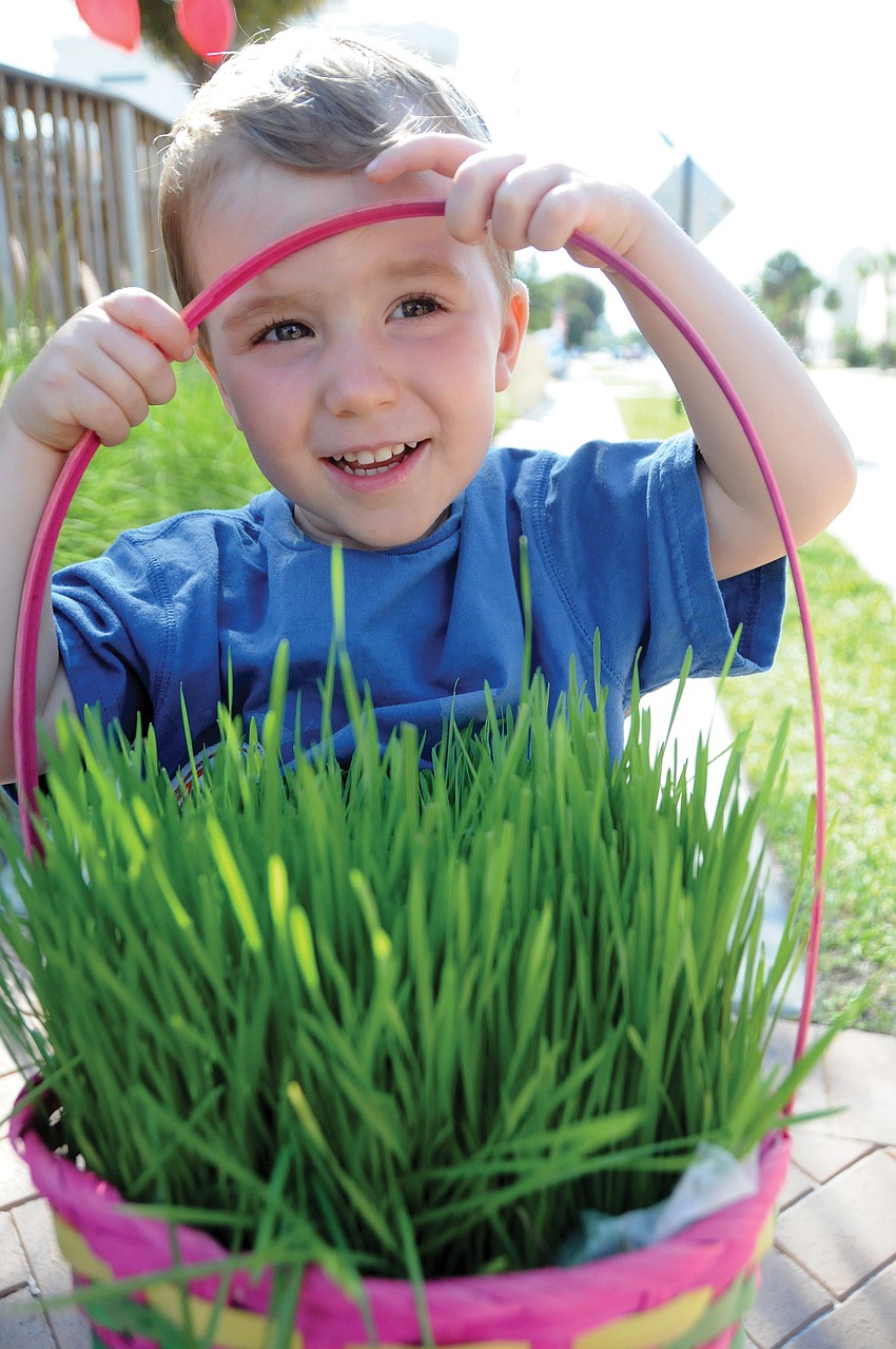 Buck, 2, even grew his own grass for his Easter basket, so he would have a safe place for all his eggs from the Village Easter Egg Hunt.