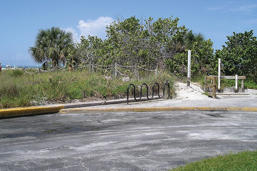 Complaints about water standing at an outdoor shower at Siesta Public Beach prompted county plans for improvements.