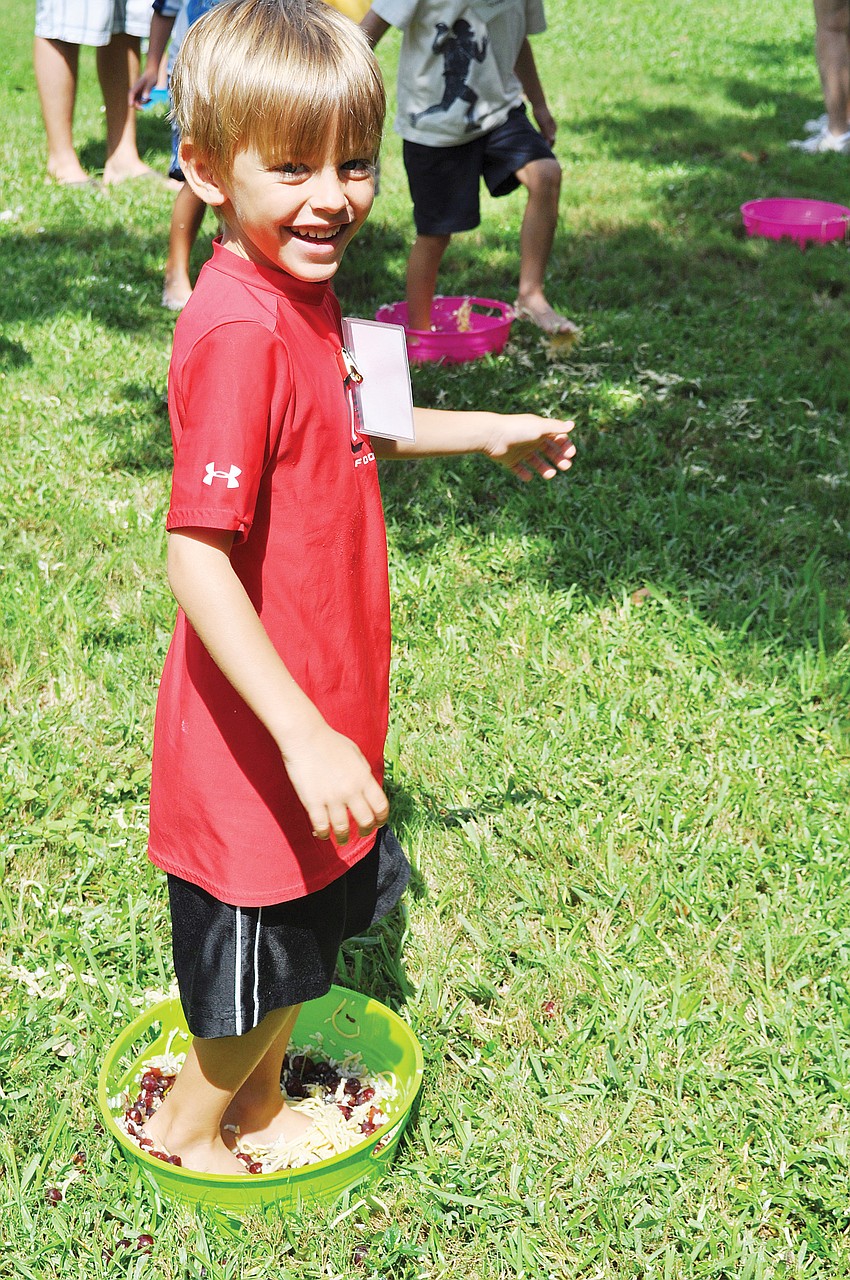 Rhett Morton stomped on spaghetti in August during Church of the Redeemer's Vacation Bible School.